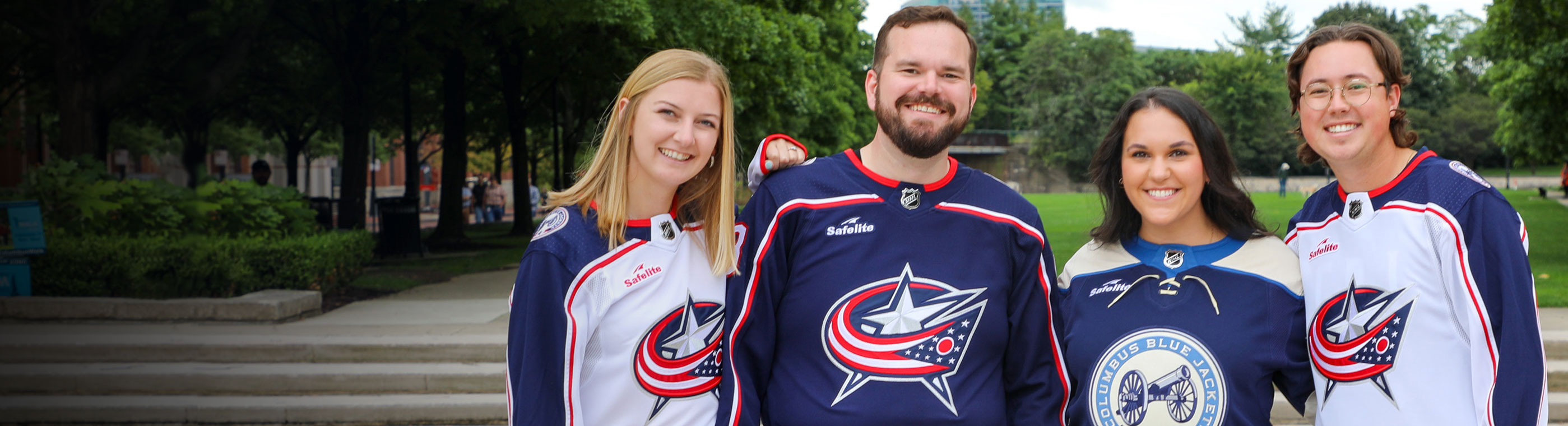 Four friends wearing Columbus Blue Jacket Jerseys