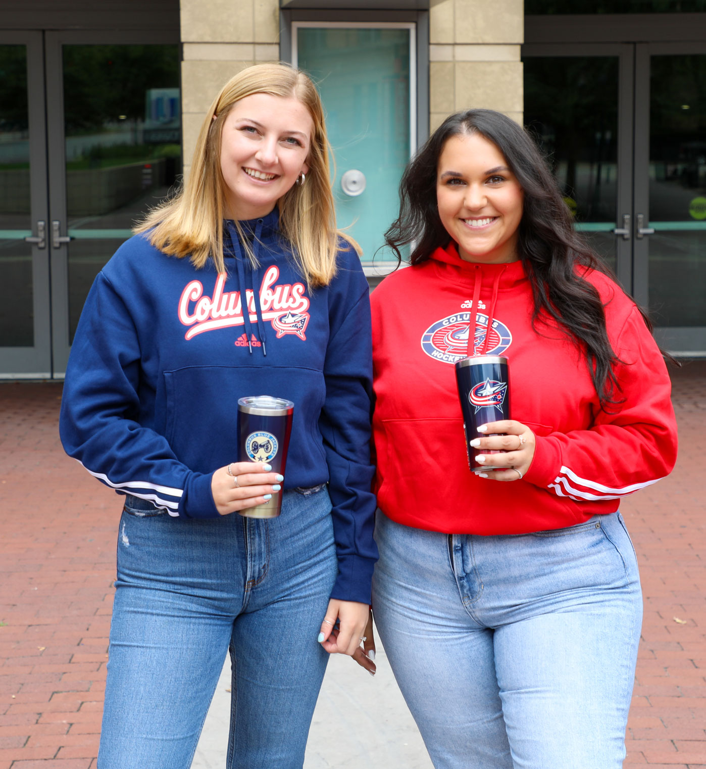 Two friends wearing Columbus Blue Jackets Gear